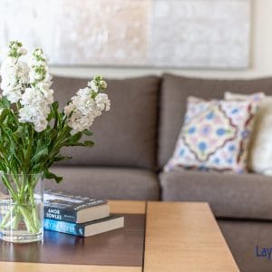 flowers in vase on table in living room.