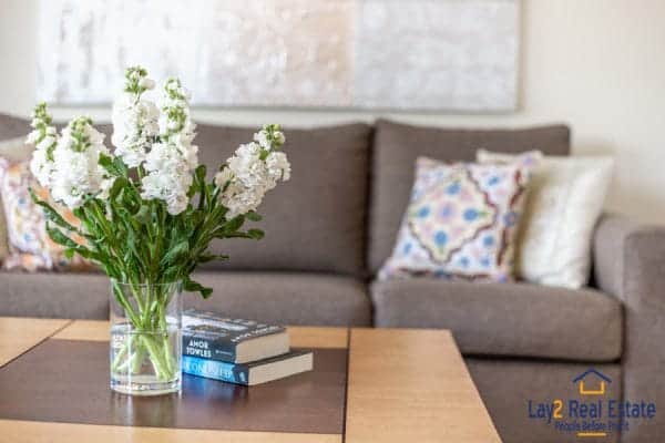 flowers in vase on table in living room.