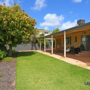 Backyard grassed area picture.