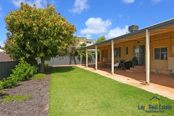 Backyard grassed area picture.