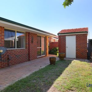 Rear grassed area picture and store room picture at 3-146 Shakespeare Avenue Yokine WA 6060.