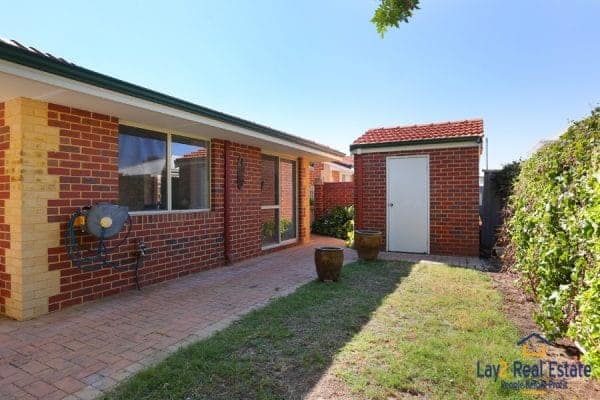 Rear grassed area picture and store room picture at 3-146 Shakespeare Avenue Yokine WA 6060.