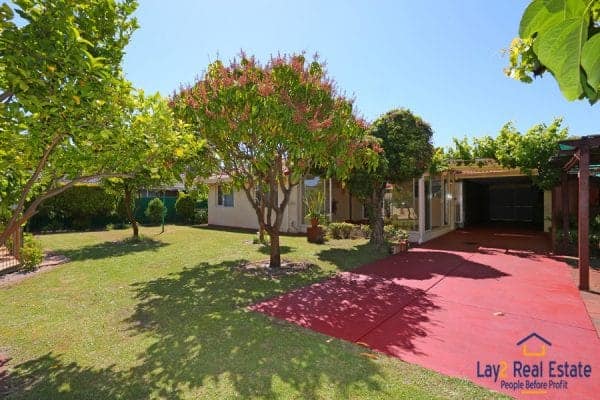 Backyard and driveway picture.