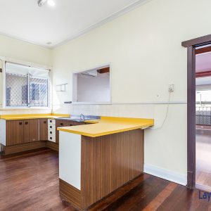 Kitchen with yellow bench tops picture
