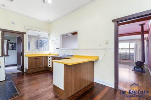 Kitchen with yellow bench tops picture