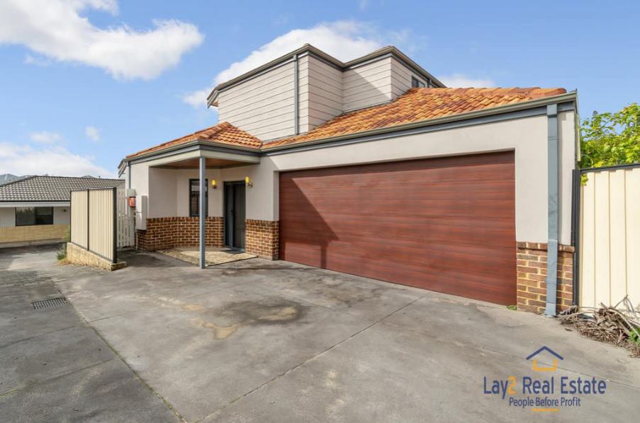 Introducing a Captivating Townhouse. 10A Foyle Road Bayswater WA - view from outside of the lockup gargae door image.