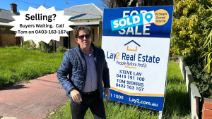 Properties Wanted to Sell. Tom standing in front of a recent property's sold sign board image.